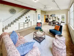 4403...In this picture you see the stairwell to the upper floor and door to the hallway for access to the main floor full bath, den and large storage room.
