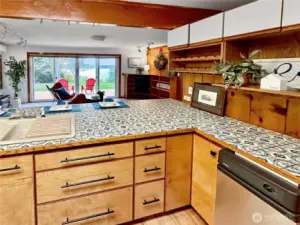 4403...The kitchen offers a view of the family room, deck and outdoors with sound, sunsets and boat traffic views!