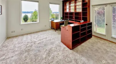 4403...Private Library with built-ins and French doors to the side deck.