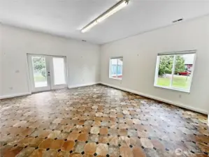 This space is one of two rooms on the main floor of the detached garage/shop/office space.  It features a private full bath and propane forced heating system and washer/dryer hookups.