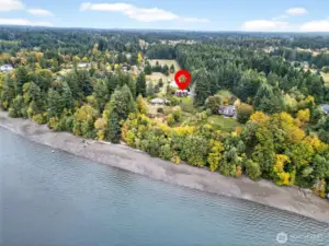 Aerial view shows main house, 2nd house, detached garage/shop/office and pasture area.