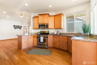 This kitchen view showcases its open connection to the living room, enhancing the home’s spacious feel and effortless flow for entertaining.