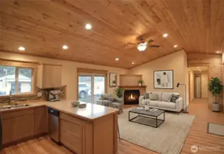 Chef's Kitchen features custom solid-wood cabinetry, soft-close drawers & durable scratch-resistant plank flooring. Wood-wrapped windows, custom doors, and Smart LED lighting throughout.