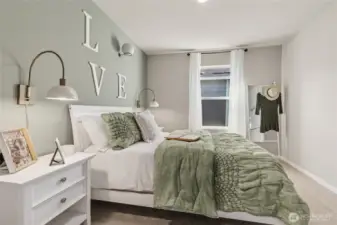 1 of 2 hall bedrooms with walk-in closet.  Finishes and colors may vary.