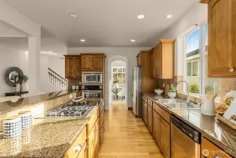 Granite countertops, built-in seating, SS appliances, tons of cabinetry for storage