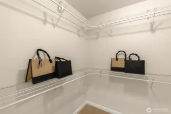 spacious his & her walk-in closets