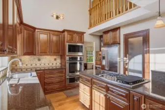 Custom kitchen with pot filler and propane cook top.