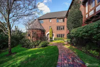 Courtyard, turret leads to parking.