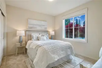 Bright third bedroom with a west-facing window, allowing plenty of sunlight