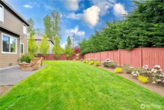 Beautifully landscaped yard with a variety of plants adding color and charm