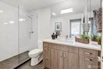 The updated 3/4 bath features a modern shower, high-end cabinetry, ceramic tile floors, and premium fixtures. You will love the quality of the Emtek cabinet pulls...they feel so nice in your hand.