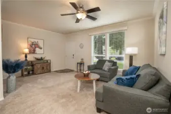 Tall windows allow lots of natural light to enter the living room for a nice light and bright space.