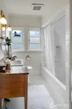 Second floor full bathroom has exquisite period details and a functional layout.