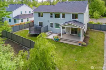 Integrated sprinkler system servicing front & rear landscapes