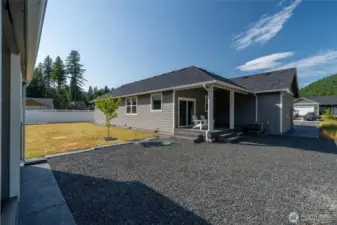 View of the back yard and covered back patio.