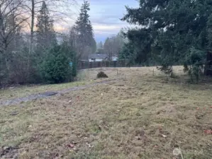 2025-12-13 West facing picture taken 52nd Ave S through Northerly .33 aces of .60 acres total.