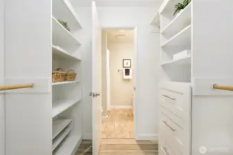 The well thought out build-ins in the walk-in closet provide ample storage  and keep everything super organized.