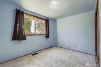 The third bedroom on the street level, closest to the bath and kitchen, also has a built-in closet.
