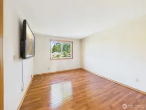 Upstairs bedroom with hardwood.