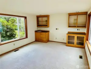 Large den with new carpet.