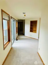 Hallway to downstairs bedroom, garage and bathroom.