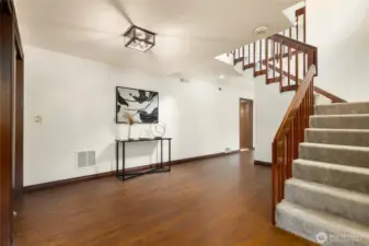 The entry way with stairs leading up to the main living area
