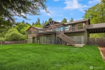 The back yard is fully fenced with a separate dog run under the deck.