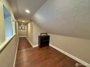 Hall way upstairs to bedrooms and great room.