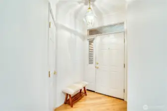 Foyer is well lit, oak floor are in wonderful condition. Traditional coat closet to your right as you enter.