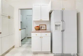 Laundry room is attached to kitchen and opens to the garage.