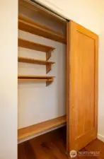 Primary Bedroom Offers Two Full Closets in Primary with Built-In Shelving