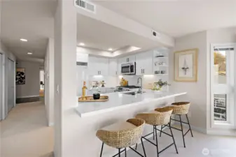 The kitchen offers new quartz countertops with bar seating.