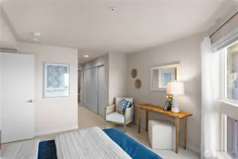 View from the primary bedroom towards the closet and ensuite bathroom.