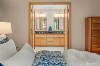 The primary bath is adjacent to the bedroom.