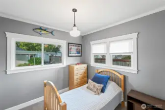 The second bedroom is across from the primary bedroom and offers an abundace of natural light and space.