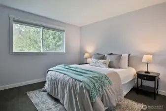 This bedroom (#1) is in the northwest part of your home and has peek-a-boo views of Lone Lake. It also has a standard sized closet (not in photo) just beyond the right edge of this photo.
