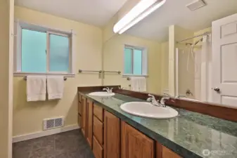 Upper level full bath located at the northern side of your home, end of the hallway close to the bedroom we just toured. Let's go check out Bedroom #2