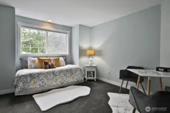 Currently set up as a guest room (this house has a 3-bedroom septic system) this room has a walk-in closet and is located right at the top of the stairs and looks out over the eastern side (front) of your home.