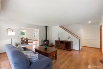 Living room with fireplace and stairs up to bedrooms