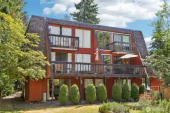 Two level condo overlooking community pool and gardens
