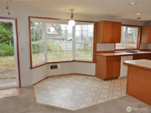 Kitchen Nook dining area w/ bay windows.