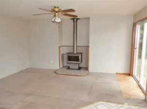 Family Room w/ free-standing wood fireplace.