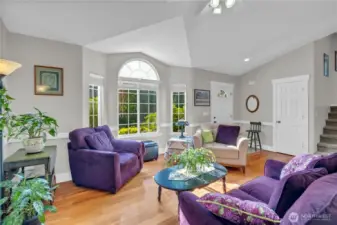 Bright and welcoming with vaulted ceilings and expansive windows that fill the space with natural light. Warm hardwood floors and an open layout create a perfect setting for relaxing or gathering with guests.