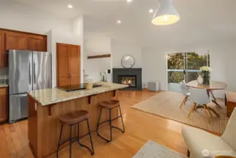 Kitchen with dining and living space with vaulted ceilings and deck. Territorial views abound from this space.