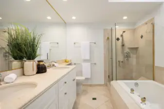 Primary bath with large walk in shower and soaking tub.