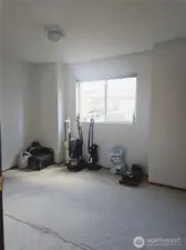 The second bedroom offers a versatile space with a large window that brings in natural light. Whether used as a guest room, home office, or hobby area, the room provides plenty of flexibility to suit your needs.