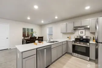 Modern kitchen with SS appliances.
