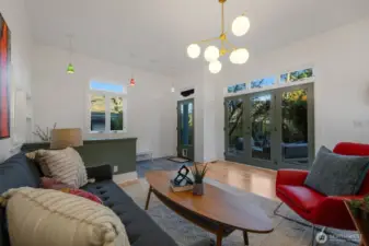 The addition, done in 2000- added over 700 sqft to the home. It starts with a wall of glass french doors and its own entrance, vaulted ceilings and maple floors- just refinished.