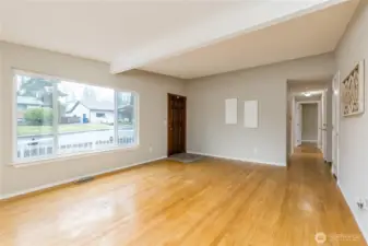 Hardwood floors extend down the hall into the 3 bedrooms
