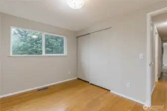 Primary bedroom at the end of the hallway